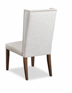 Chair with a textured backrest and wooden legs on a white background