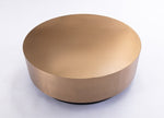 Gold-colored cylindrical object on a white background