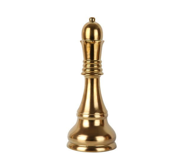 A decorative gold-colored chess queen piece with a cross on top.
