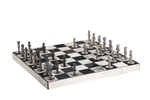 A chess set with black and white leather board pieces displayed on a chessboard.