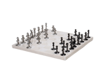 A beige marble chess board set with white and black pieces arranged on the board.