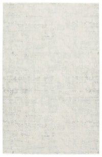 A plain gray area rug with no visible patterns or textures.