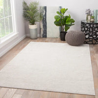 A plain gray area rug with no visible patterns or textures.