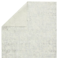 A plain gray area rug with no visible patterns or textures.
