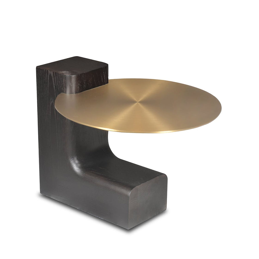 Modern side table with dark wood base and gold metal top on a white background