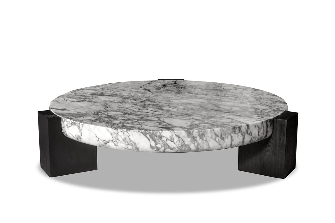A round marble coffee table with solid ash legs.