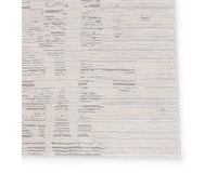 A rectangular area rug with a textured white design, featuring a subtle pattern.