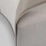 Close-up of a textured fabric surface with a neutral color palette.