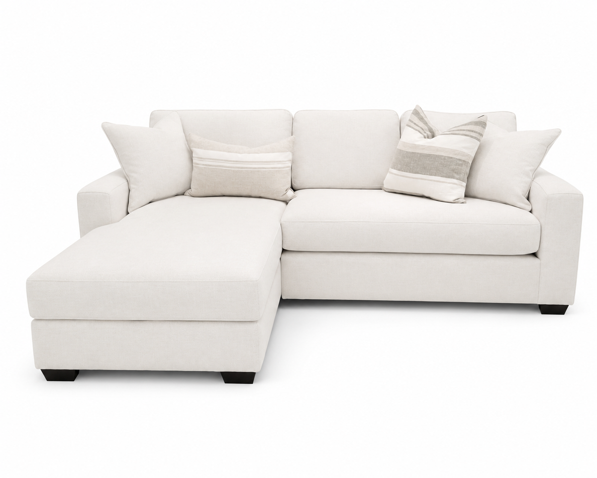A light cream or off-white upholstered sectional sofa with a left-facing chaise lounge, styled with four throw pillows including two striped accent pillows, set against a plain white background.