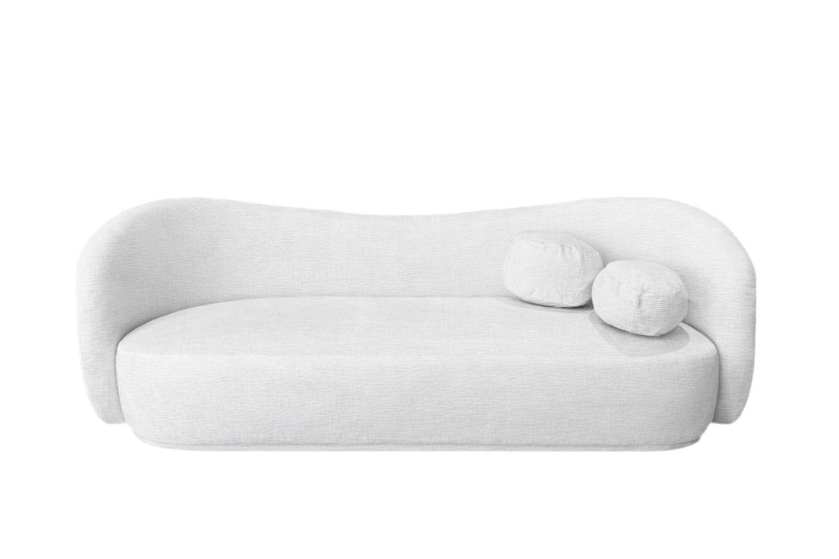 Modern white sofa with spherical cushions on a white background