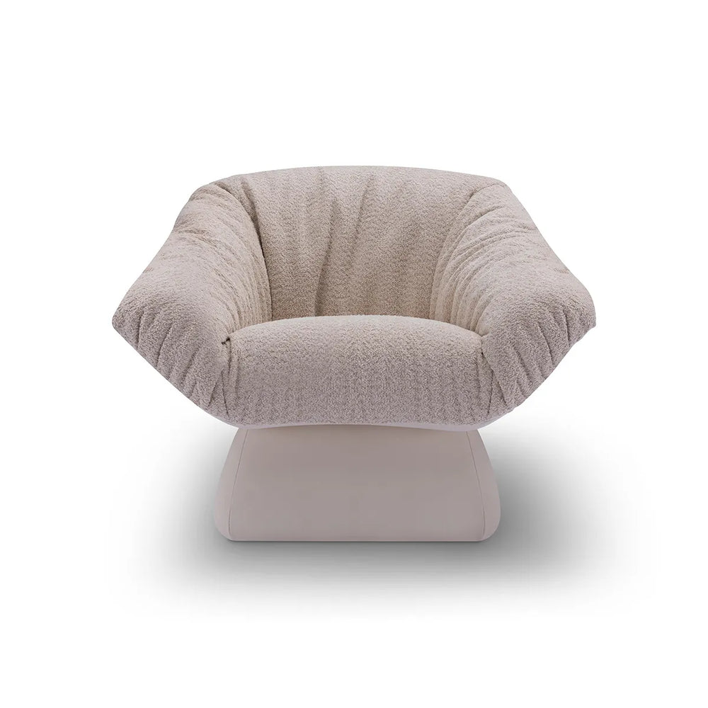 Beige textured armchair on a white background