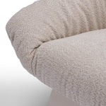 Close-up of a textured beige fabric on a white background