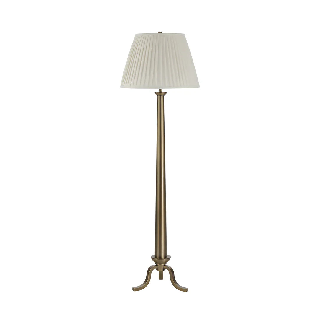 Floor lamp with a pleated white shade on a white background