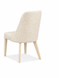 Beige upholstered chair with wooden legs on a white background