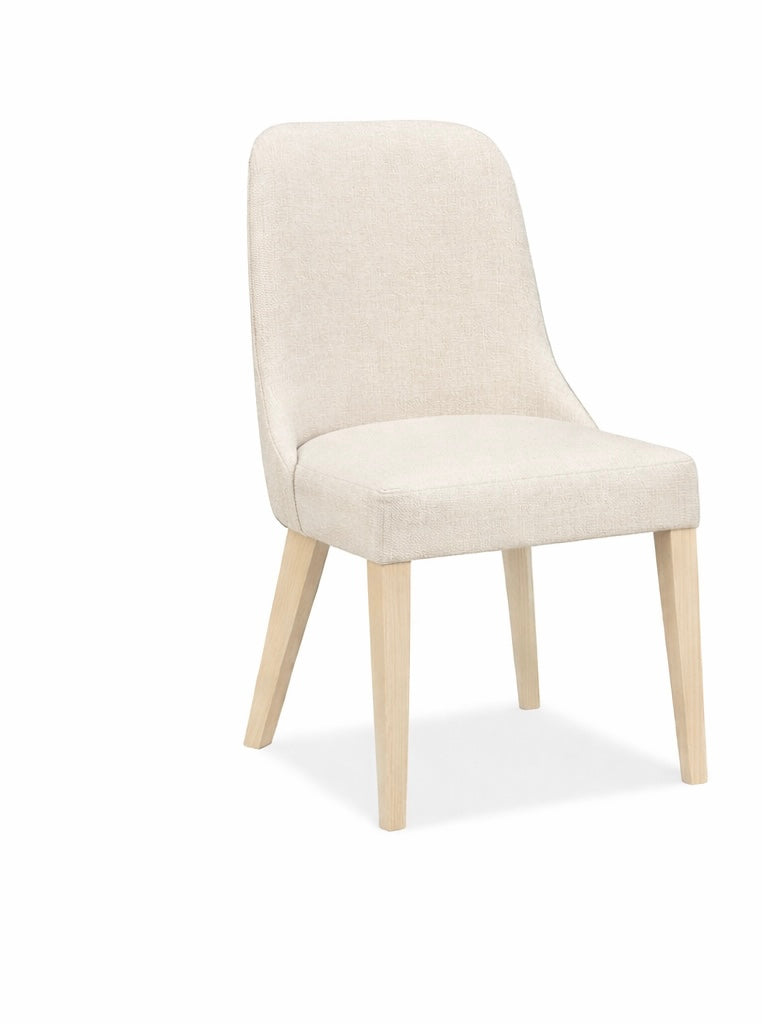 Beige chair with wooden legs on a white background