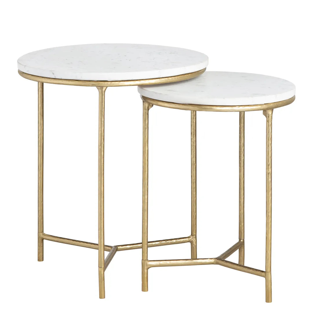Two round side tables with white marble tops and gold metal frames on a white background