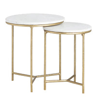 Two round side tables with white marble tops and gold metal frames on a white background