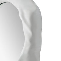 Close -up to a organic form mirror with a white background