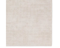 A light taupe area rug with a textured weave, handwoven from 100% pet yarn.