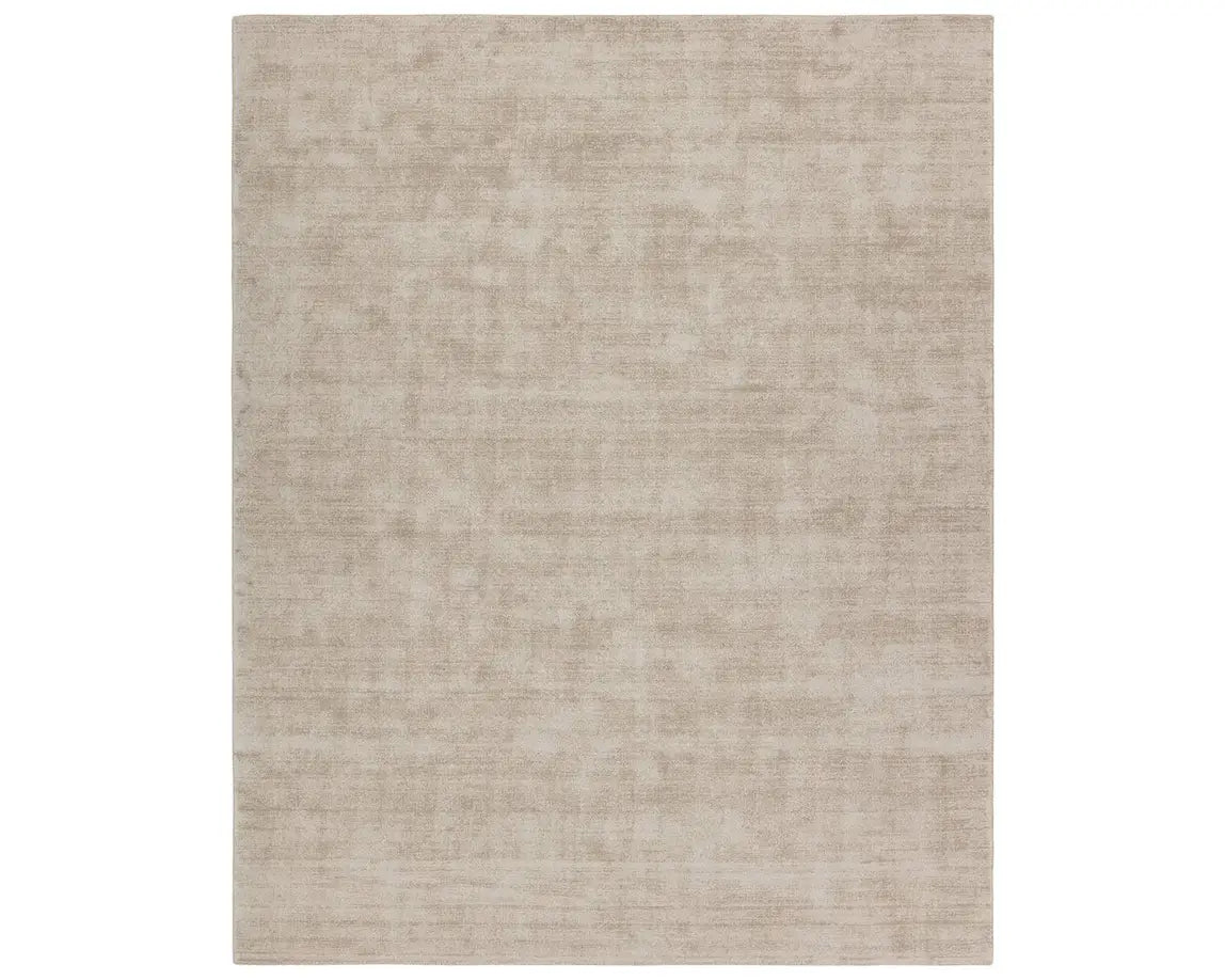 A rectangular taupe-colored area rug with a textured weave pattern.