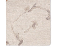 A rectangular area rug with a light gray color and a marble-like pattern, indicating a hand-tufted construction.