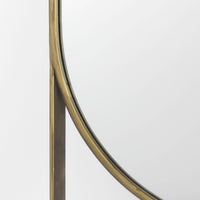 An oval-shaped full-length mirror with an antique-gold finish and a decorative bezel.