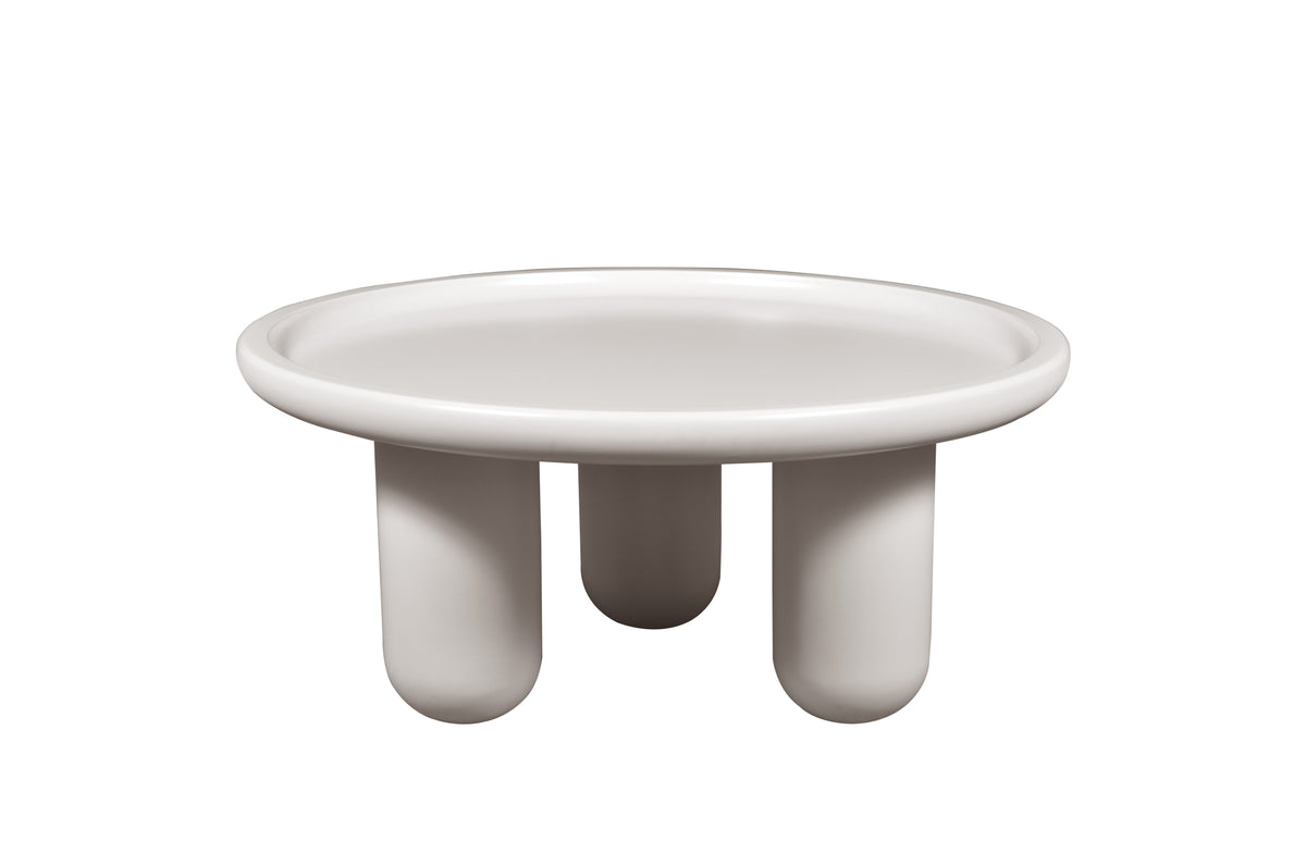 White ceramic dish with three legs on a white background
