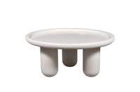 White ceramic dish with three legs on a white background
