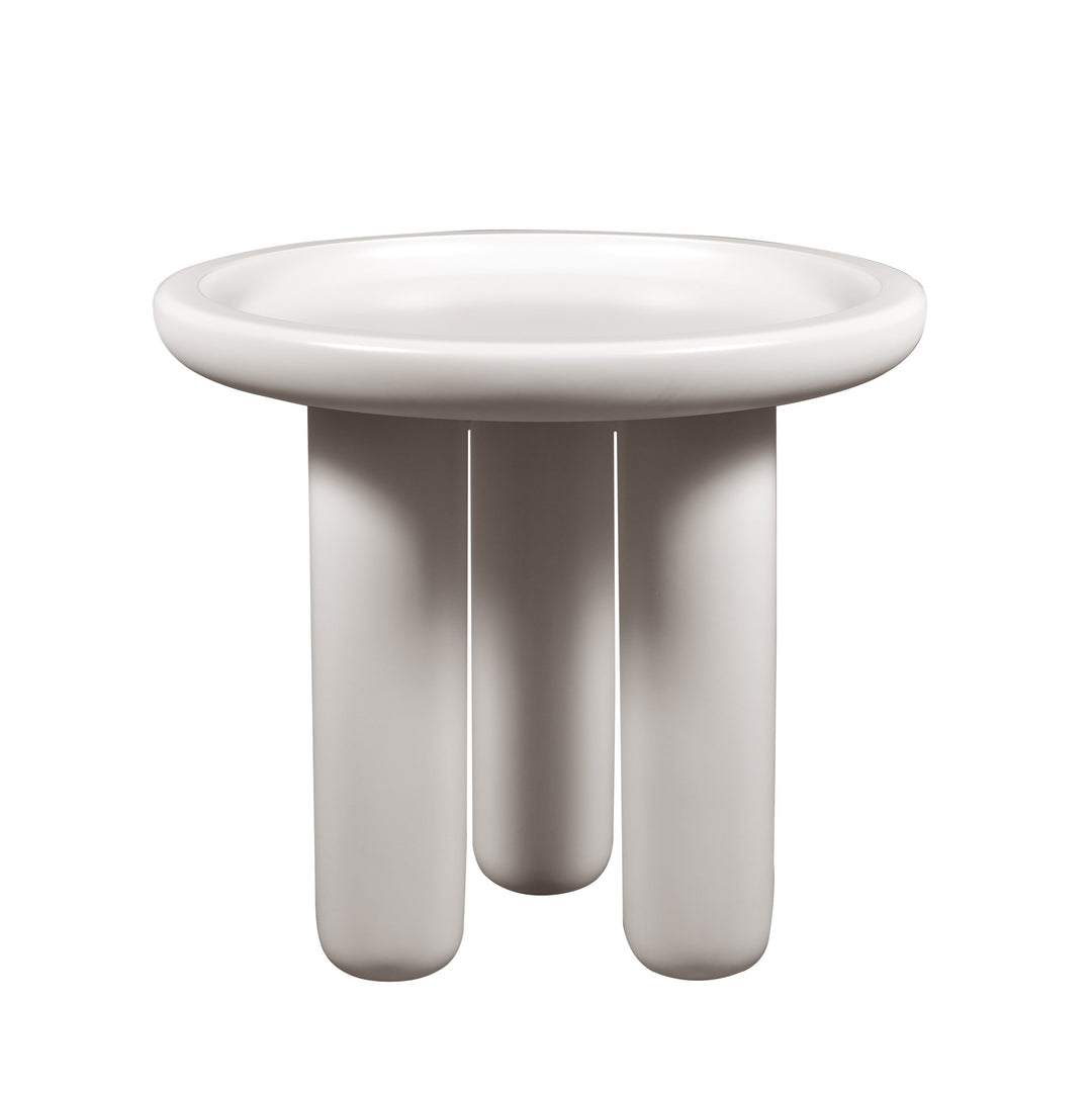 White ceramic bowl with three legs on a white background