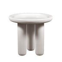 White ceramic bowl with three legs on a white background