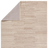 A beige area rug with a solid pattern and flat texture.