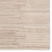 A beige area rug with a solid pattern and flat texture.