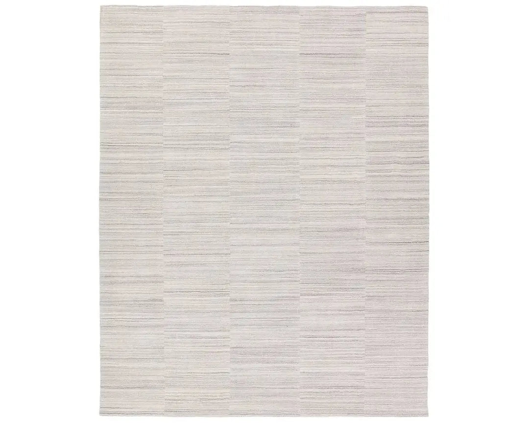 A rectangular, solid white area rug with a textured design