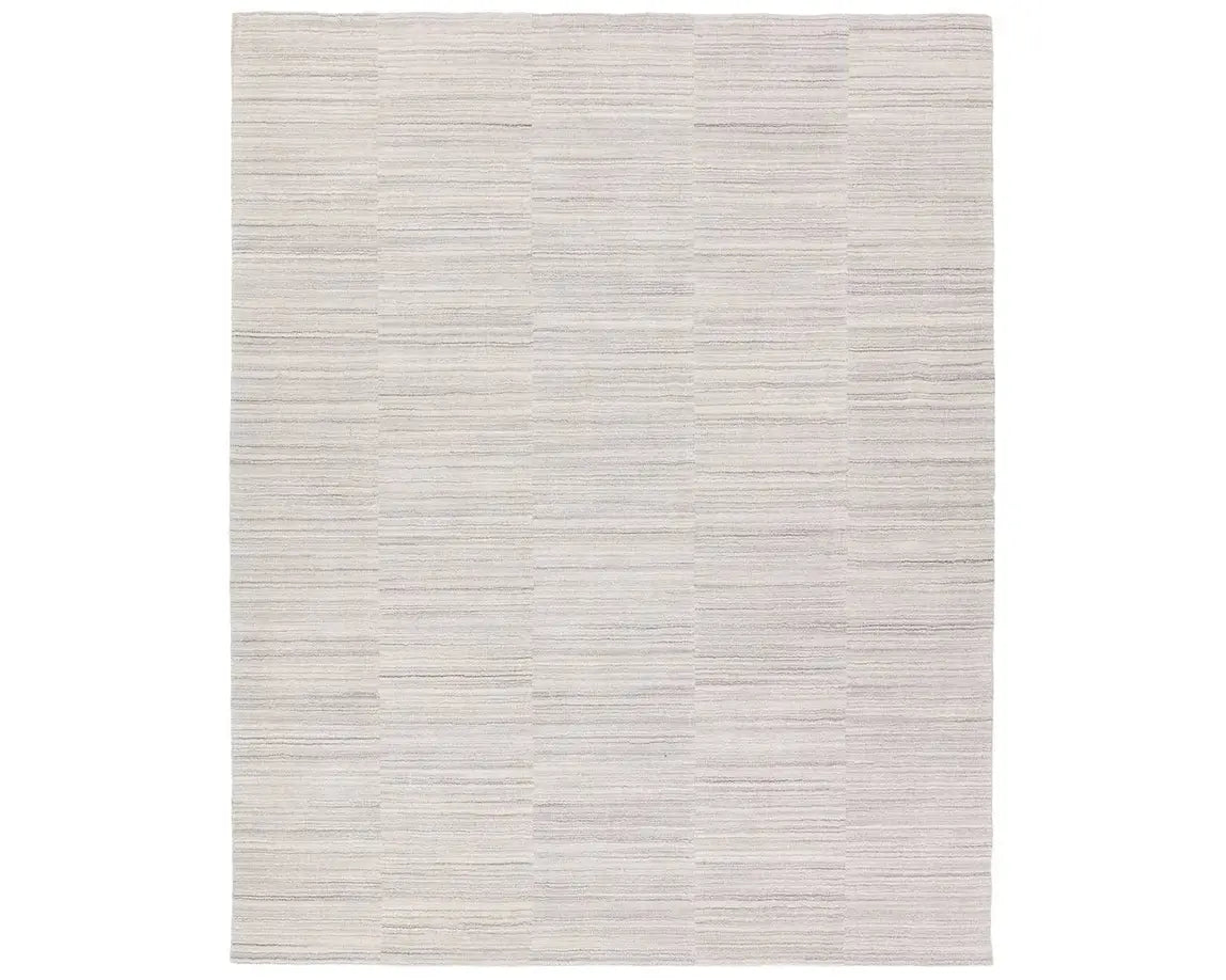 A rectangular, solid white area rug with a textured design