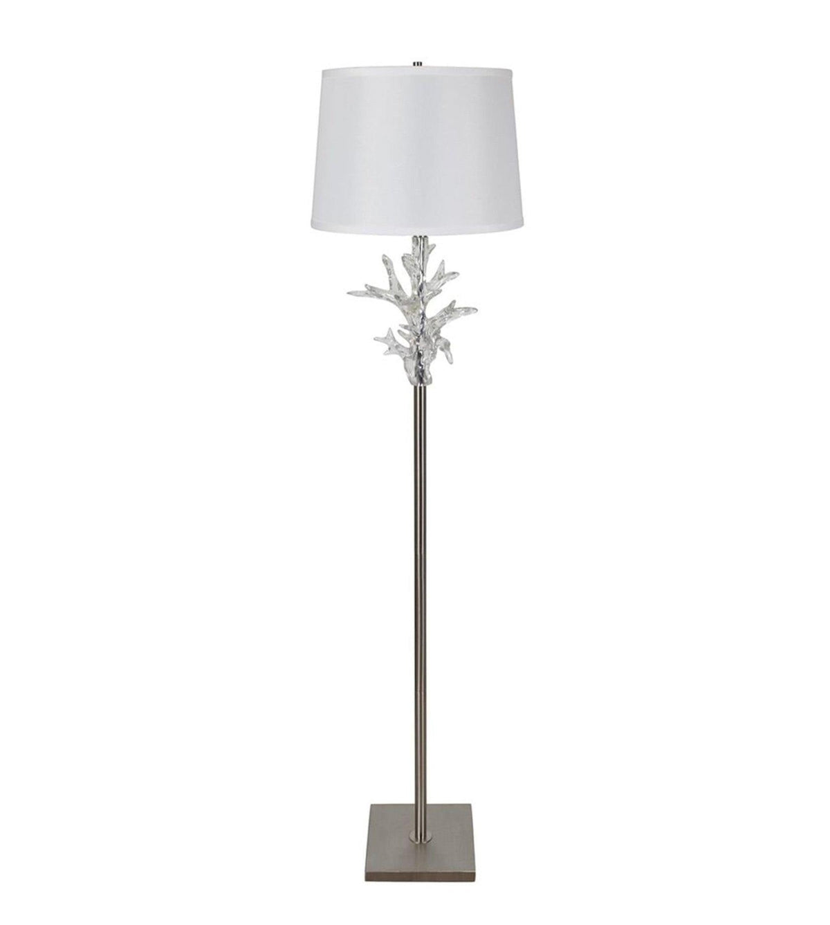 Floor lamp with decorative base and white shade on a white background