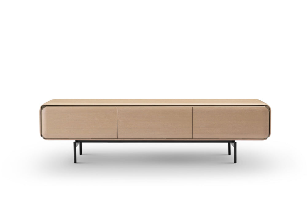 Wooden sideboard with three doors on a white background