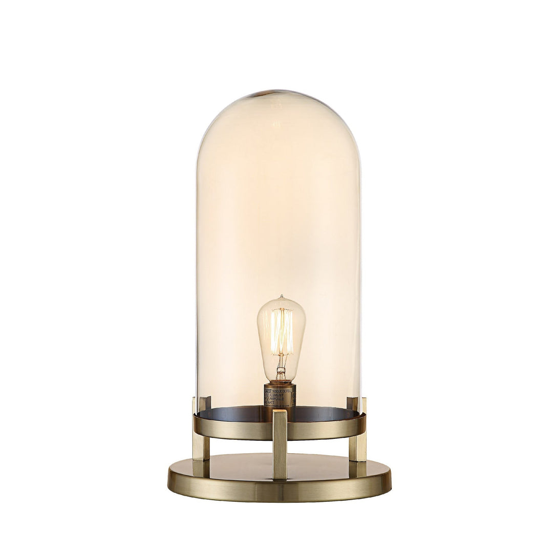 A table lamp with a brass finished dome top and a smoked glass base.