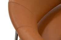 Close-up of a brown leather chair armrest on a white background