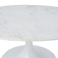 An oval marble coffee table with a white cast aluminum base and a natural white marble top.