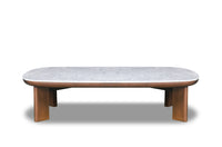 A rectangular coffee table with a marble top and walnut finish legs.