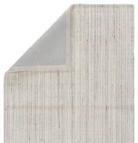 An ivory and gray area rug with a handwoven texture.