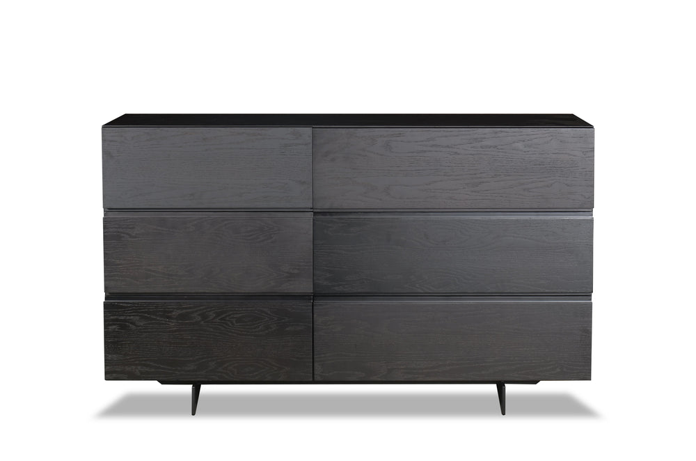 Black dresser with multiple drawers on a white background