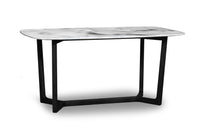 Dining table with marble top and black metal legs on a white background