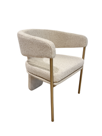 Beige armchair with gold legs on a white background