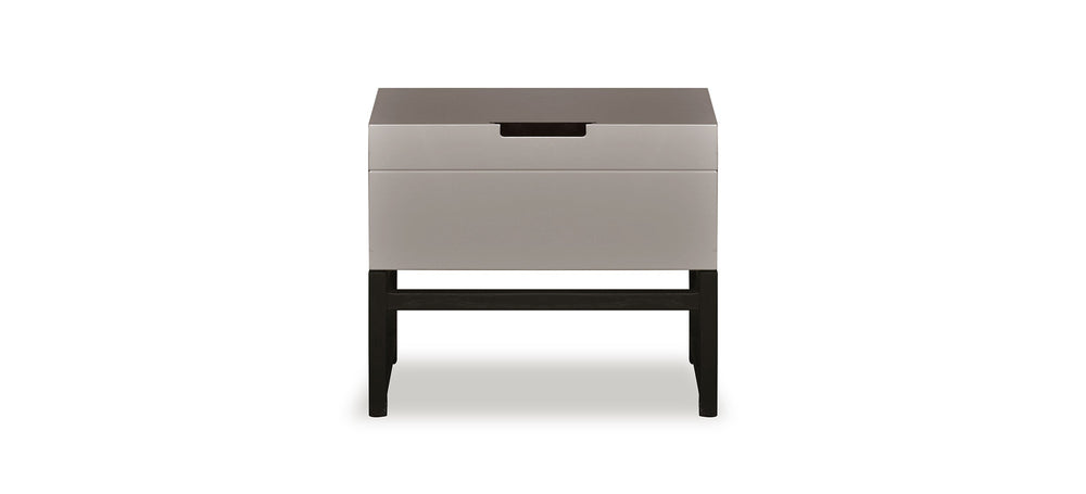 Small side table with a gray top and black base on a white background