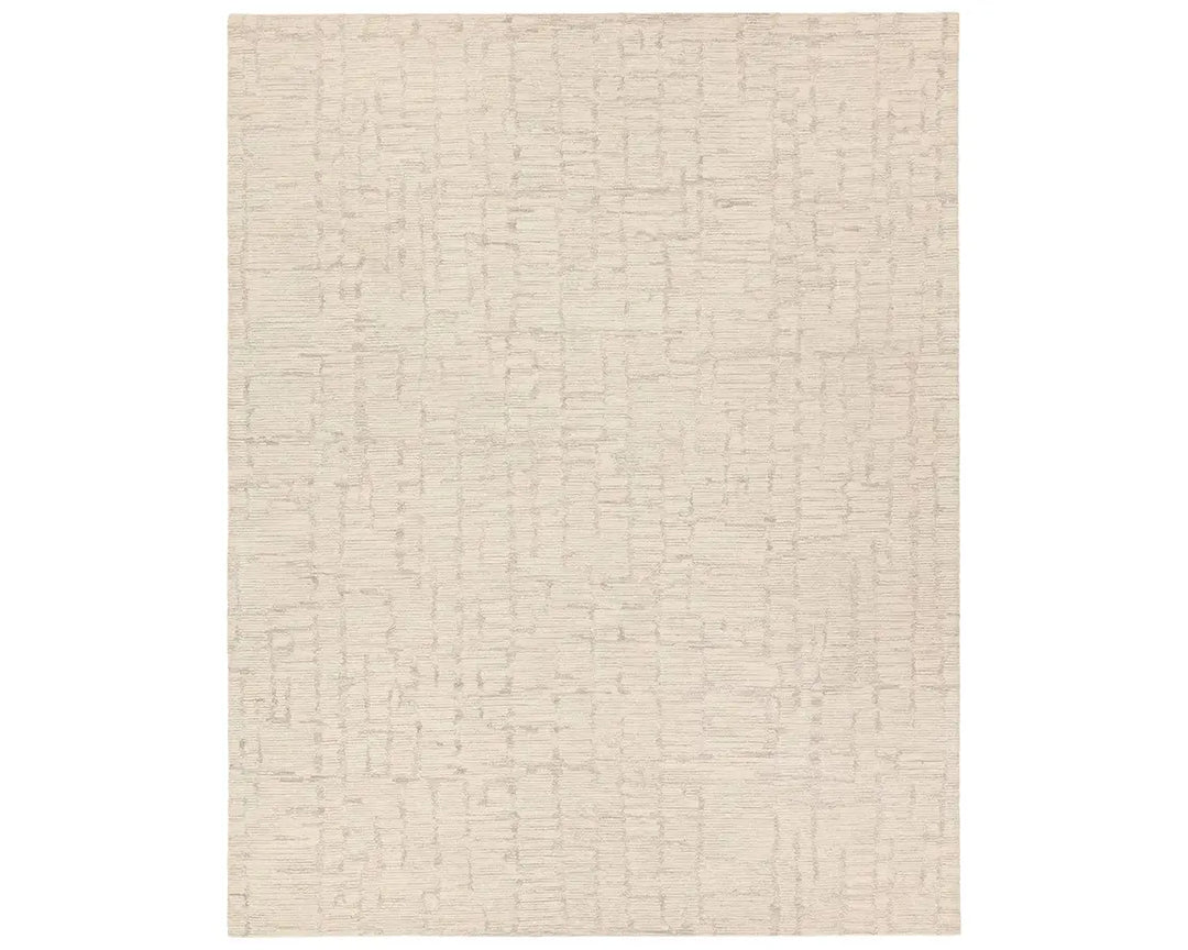 Light beige wool area rug with a hand-tufted texture
