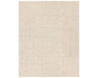 Light beige wool area rug with a hand-tufted texture