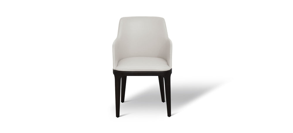 White chair with black legs on a white background