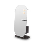 Modern floor lamp with a white shade and black base on a white background