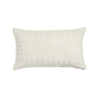 White decorative pillow with textured border on a white background